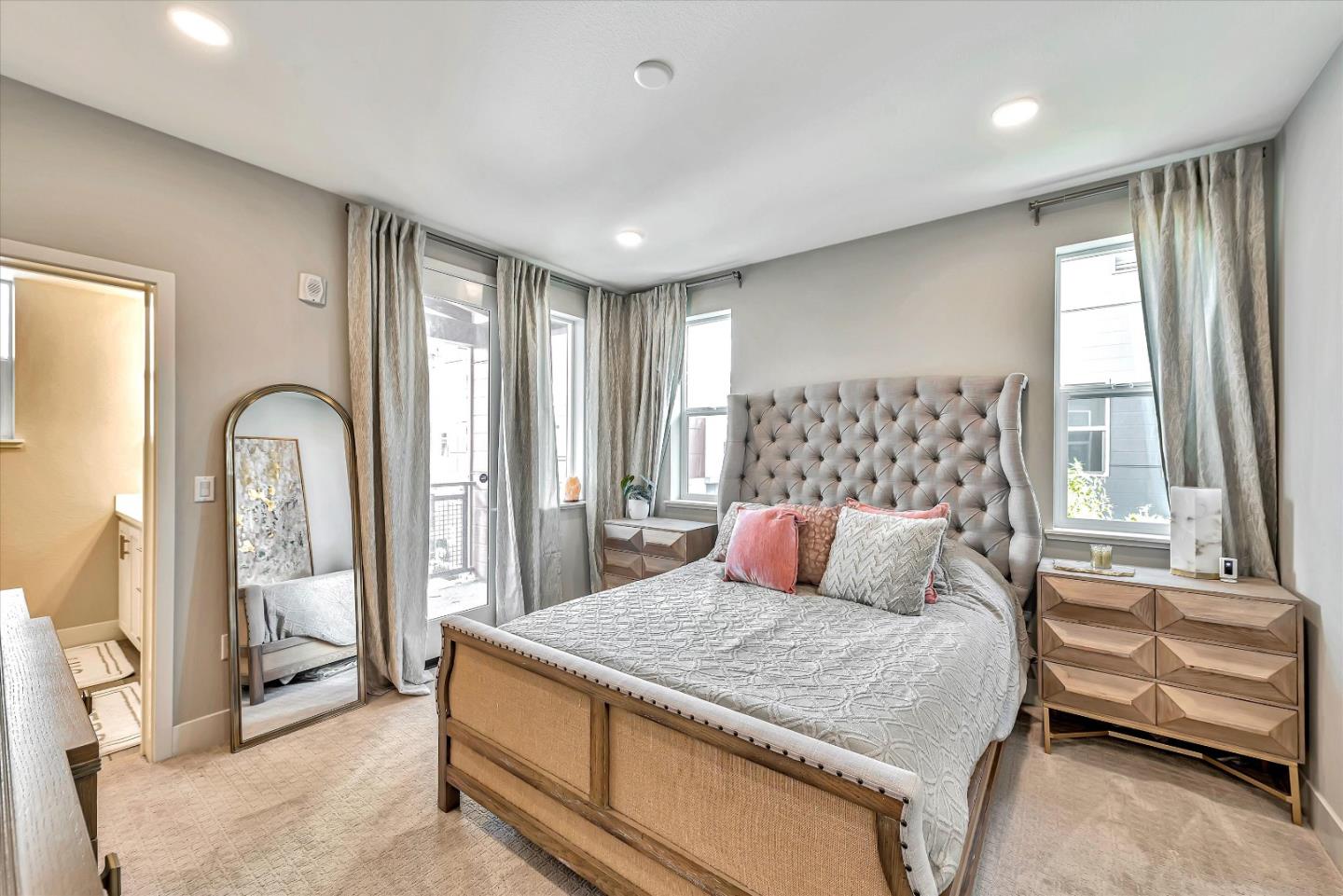 1512 Bond Street Milpitas, CA 95035 - Photo 26 of 49 a bedroom with a large bed and a large window