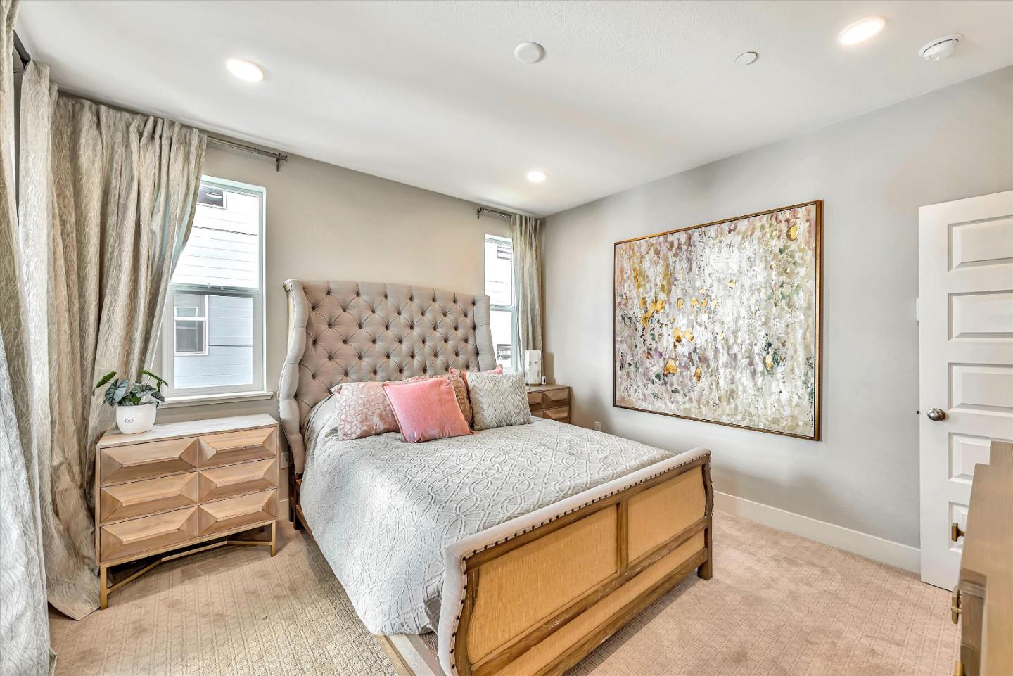 1512 Bond Street Milpitas, CA 95035 - Photo 27 of 49 a bedroom with a bed and a painting on the wall