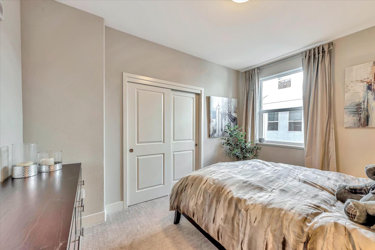 1512 Bond Street Milpitas, CA 95035 - Photo 30 of 49 a bed sitting in a bedroom next to a window