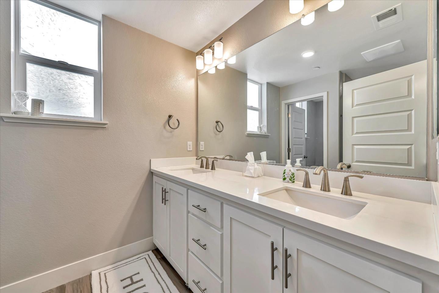 1512 Bond Street Milpitas, CA 95035 - Photo 37 of 49 a bathroom with a double vanity sink and a mirror