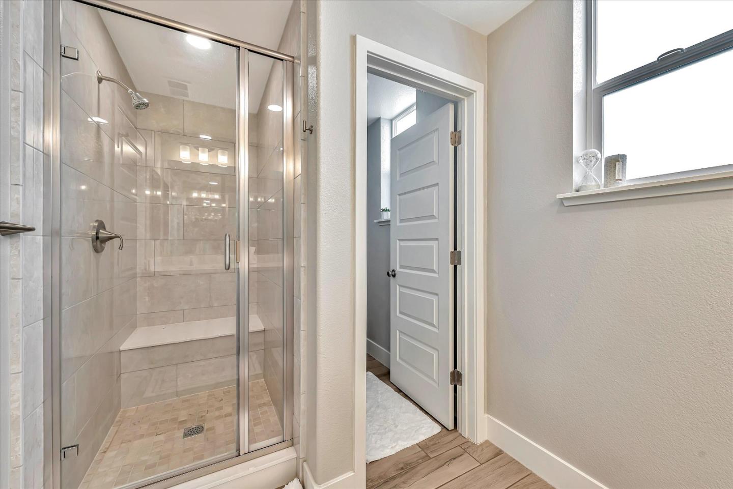 1512 Bond Street Milpitas, CA 95035 - Photo 38 of 49 a bathroom with a glass shower door