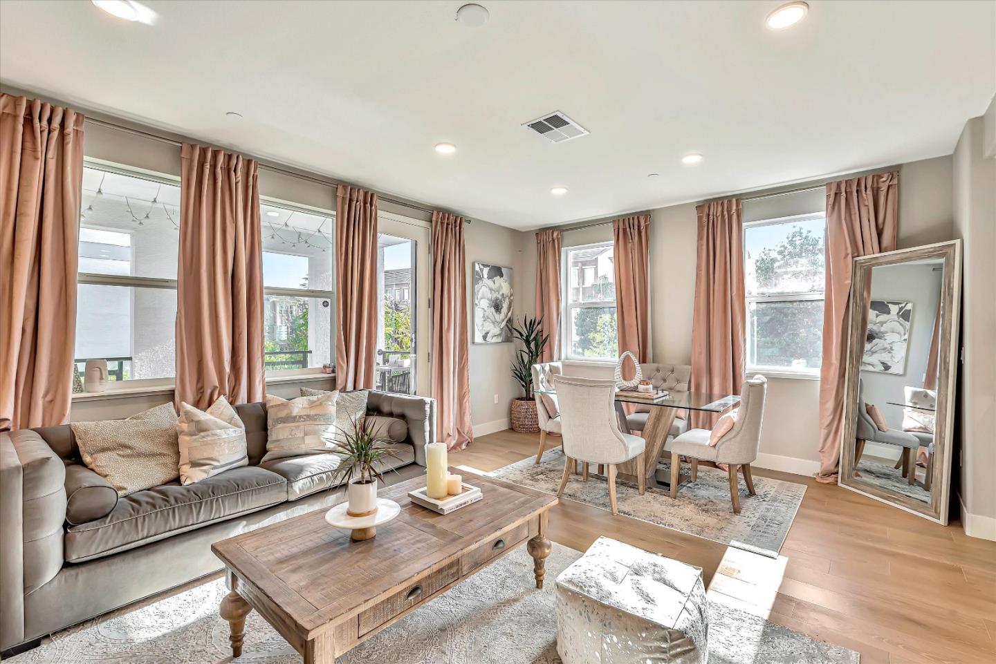 1512 Bond Street Milpitas, CA 95035 - Photo 5 of 49 a living room with furniture and large windows with wooden floor