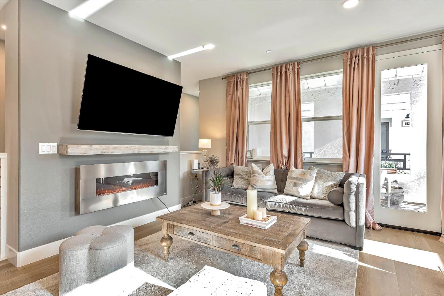 1512 Bond Street Milpitas, CA 95035 - Photo 7 of 49 a living room with fireplace furniture and a flat screen tv