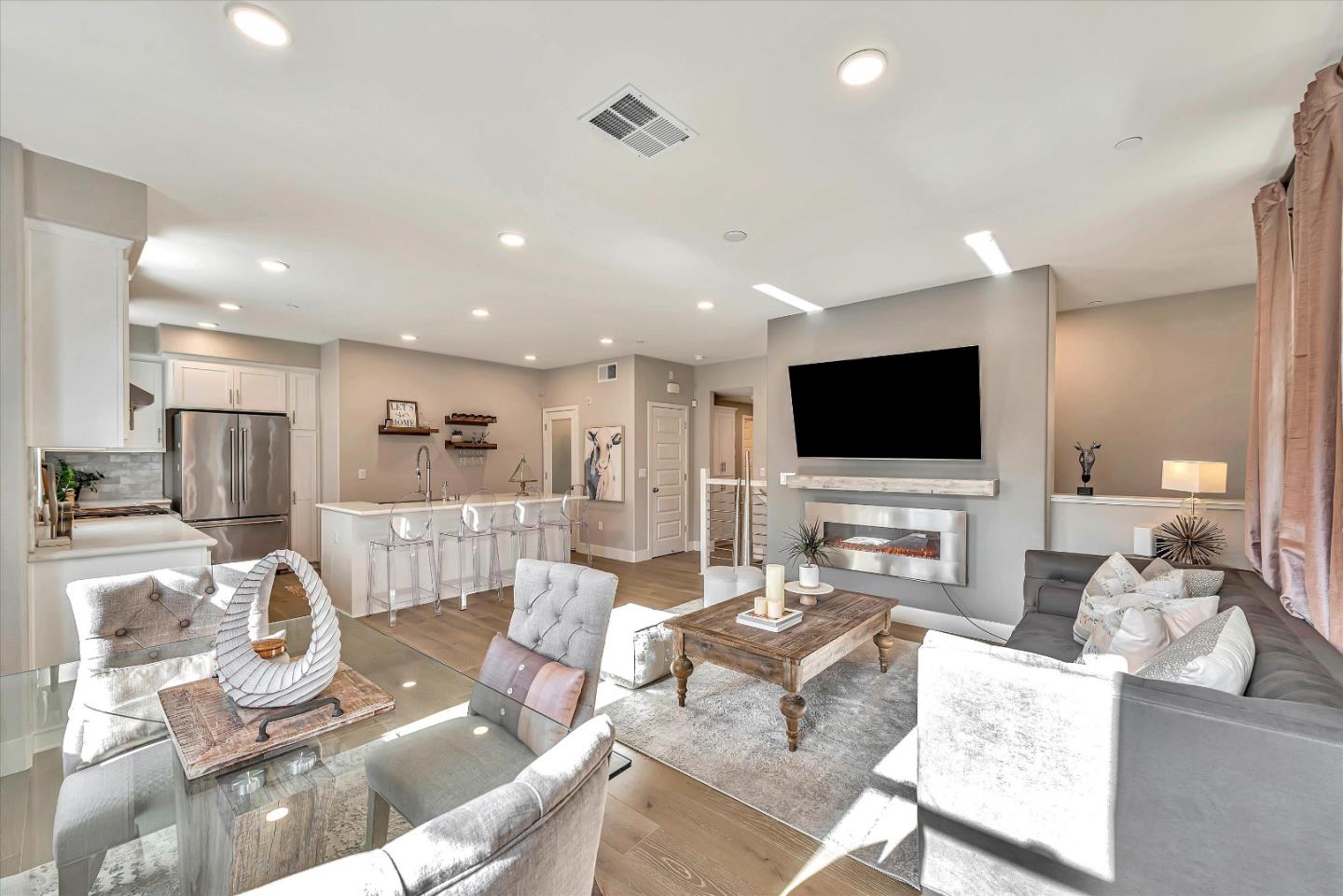 1512 Bond Street Milpitas, CA 95035 - Photo 9 of 49 a living room with fireplace furniture and a flat screen tv