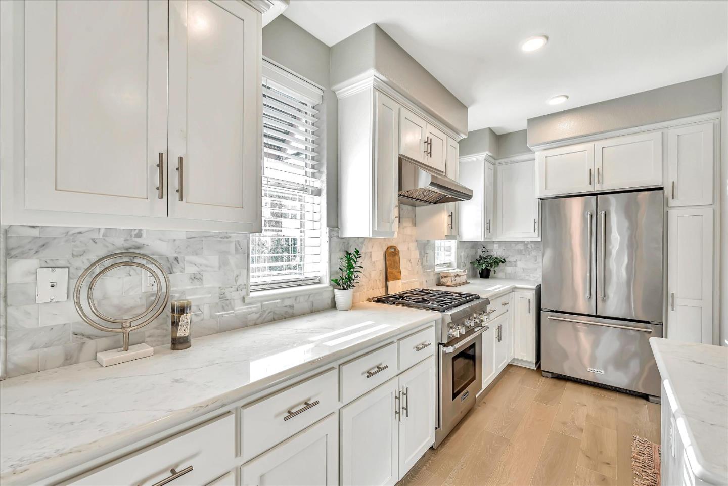 1512 Bond Street Milpitas, CA 95035 - Photo 10 of 49 a kitchen with a sink a refrigerator and window