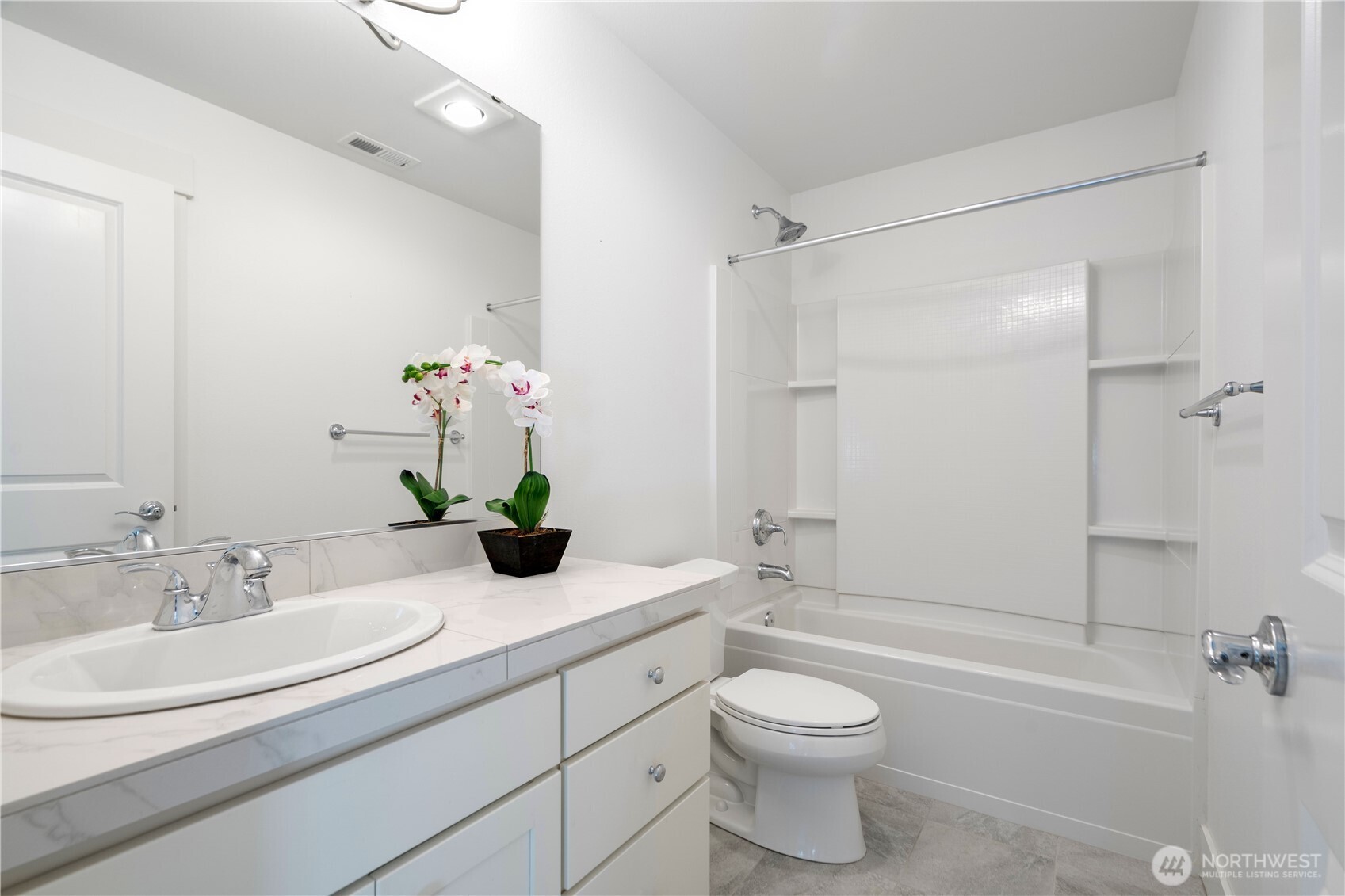 18717 43rd Drive Southeast Bothell, WA 98012 - Photo 20 of 26 a bathroom with a bathtub shower sink vanity mirror and toilet