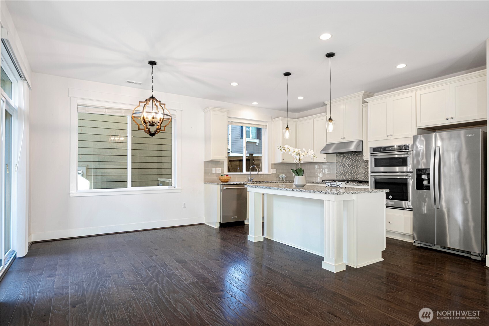 18717 43rd Drive Southeast Bothell, WA 98012 - Photo 6 of 26 a kitchen with a refrigerator sink and cabinets