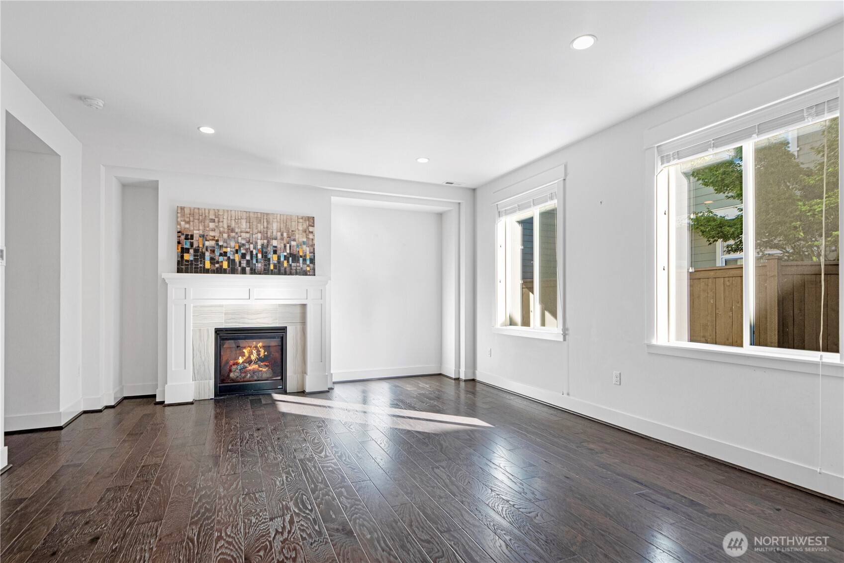 18717 43rd Drive Southeast Bothell, WA 98012 - Photo 7 of 26 a view of an empty room with wooden floor and a window