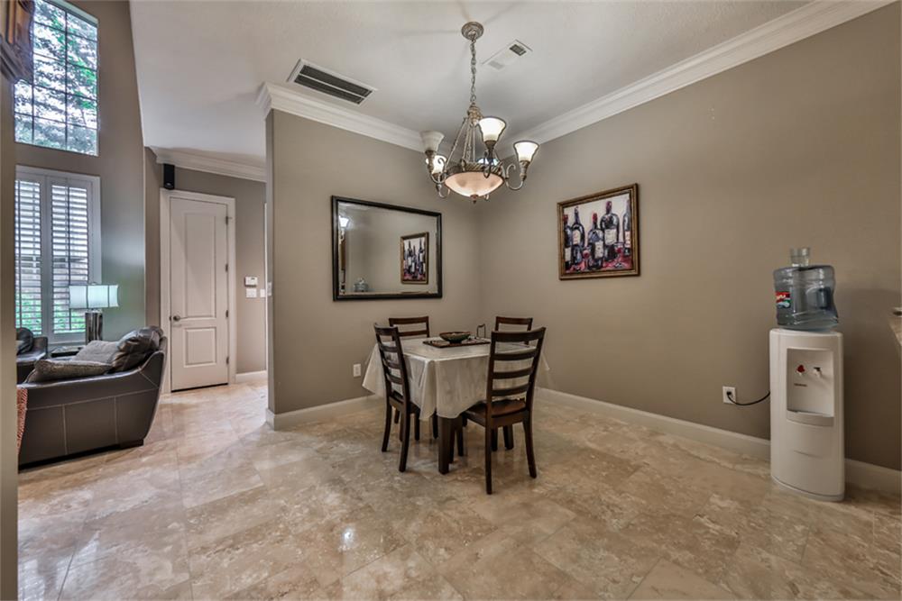 1005 Memorial Village Drive Houston, TX 77024 - Photo 11 of 32 a view of a livingroom with furniture and a chandelier