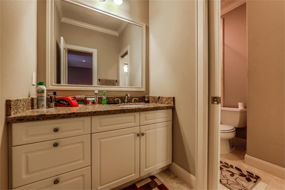 1005 Memorial Village Drive Houston, TX 77024 - Photo 24 of 32 a bathroom with a sink and a mirror