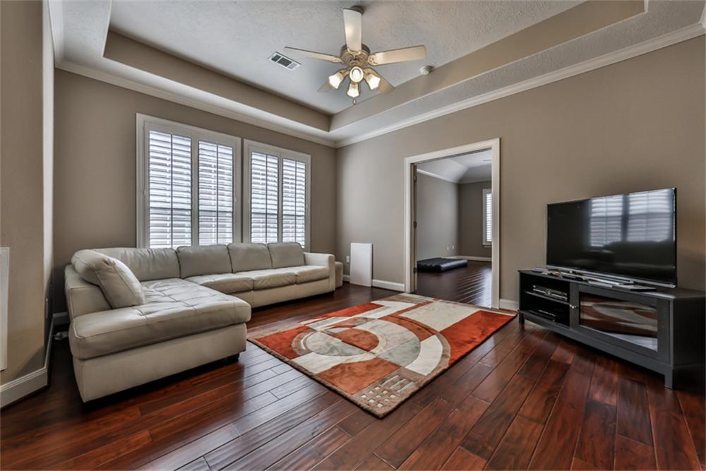 1005 Memorial Village Drive Houston, TX 77024 - Photo 28 of 32 a living room with furniture and a flat screen tv