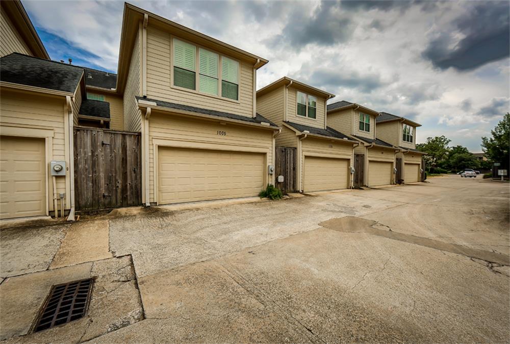 1005 Memorial Village Drive Houston, TX 77024 - Photo 31 of 32 a front view of a house with a yard