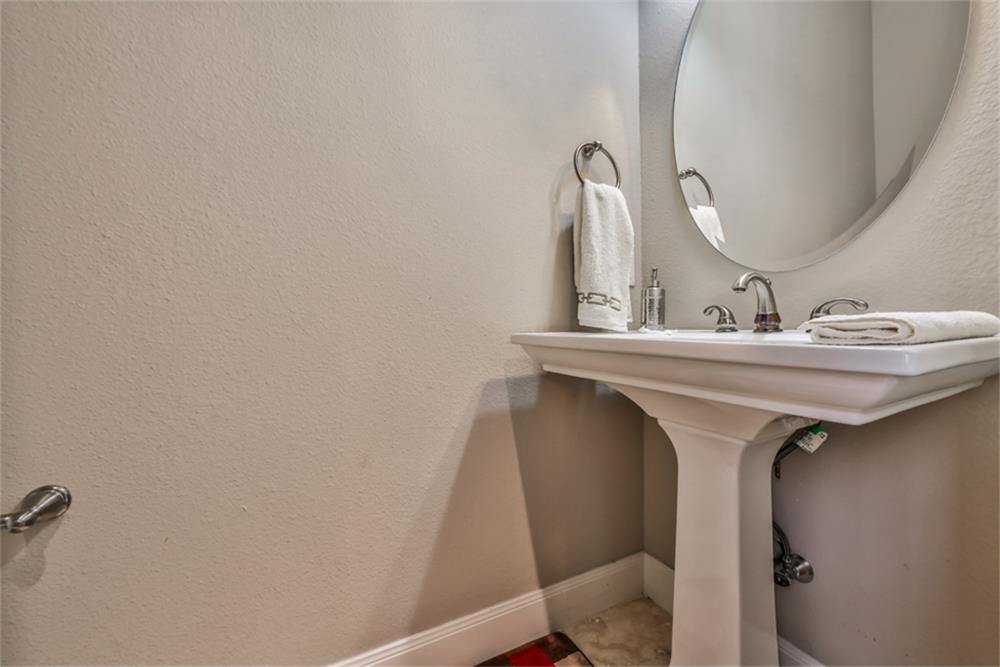 1005 Memorial Village Drive Houston, TX 77024 - Photo 5 of 32 a bathroom with a sink and a mirror
