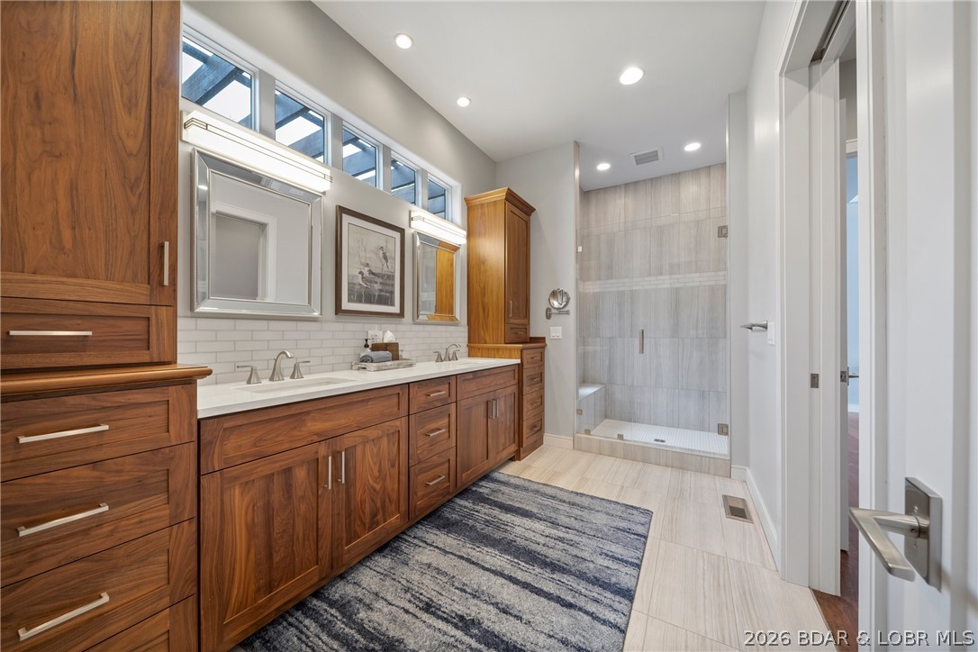 777 Malibu Road Osage Beach, MO 65065 - Photo 51 of 100 Walk in Master Bathroom is crisp and clean and fun