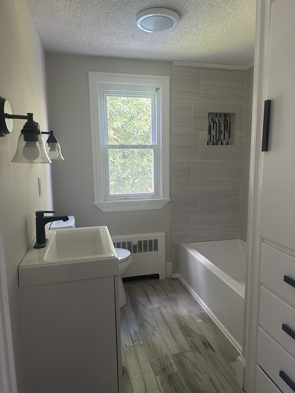 144 Stony Hill Road Wilbraham, MA 01095 - Photo 11 of 15 a bathroom with a tub sink and mirror
