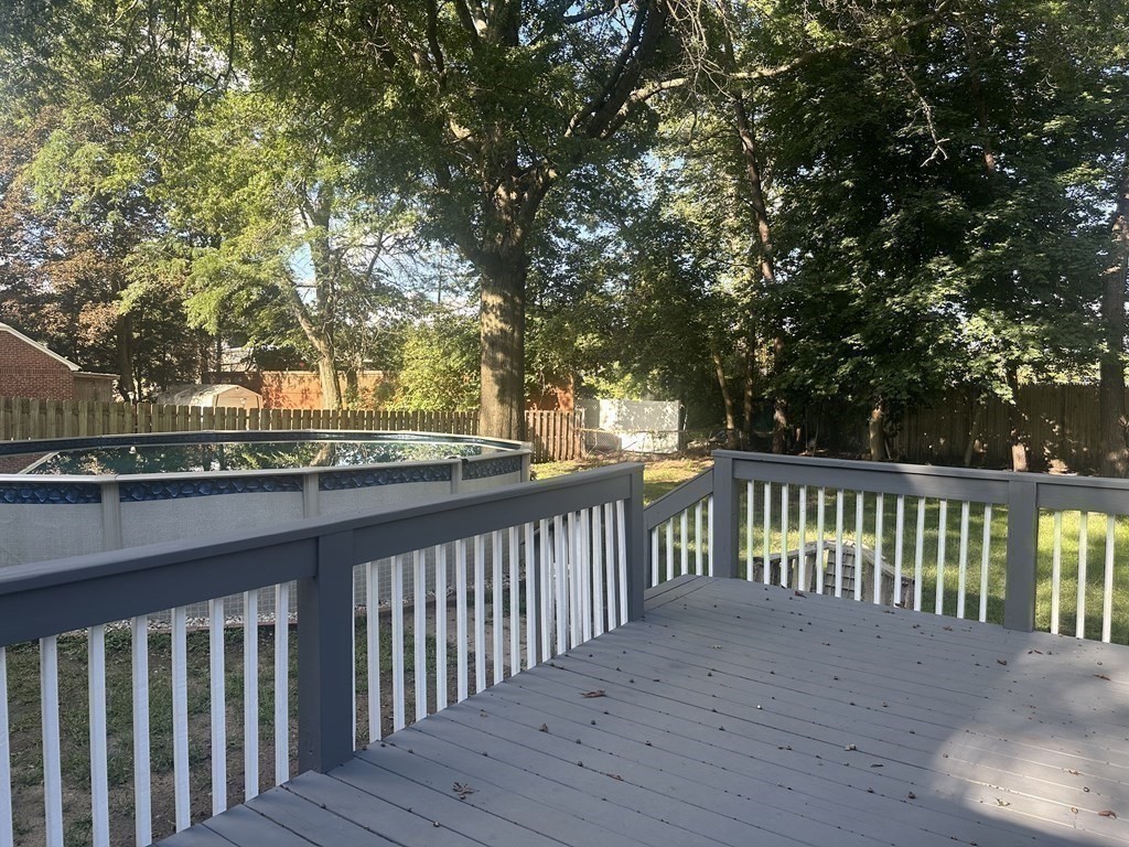 144 Stony Hill Road Wilbraham, MA 01095 - Photo 13 of 15 a balcony with wooden floor and fence