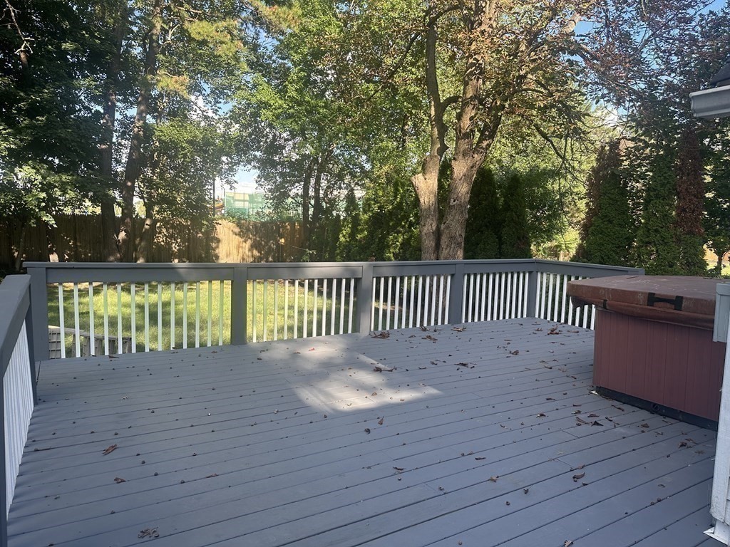144 Stony Hill Road Wilbraham, MA 01095 - Photo 15 of 15 a view of a deck and trees with wooden fence