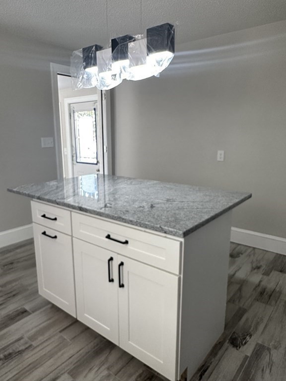 144 Stony Hill Road Wilbraham, MA 01095 - Photo 8 of 15 a view with granite countertop white cabinets and a granite counter top