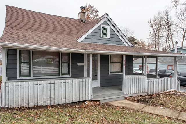 a front view of a house with a porch