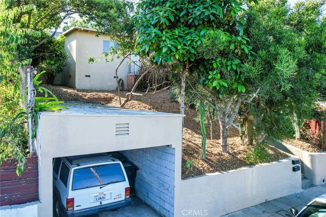an aerial view of a house with yard