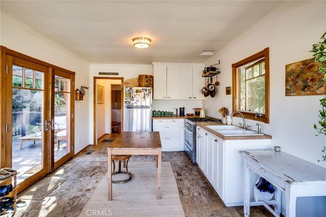a kitchen with counter top space and sink