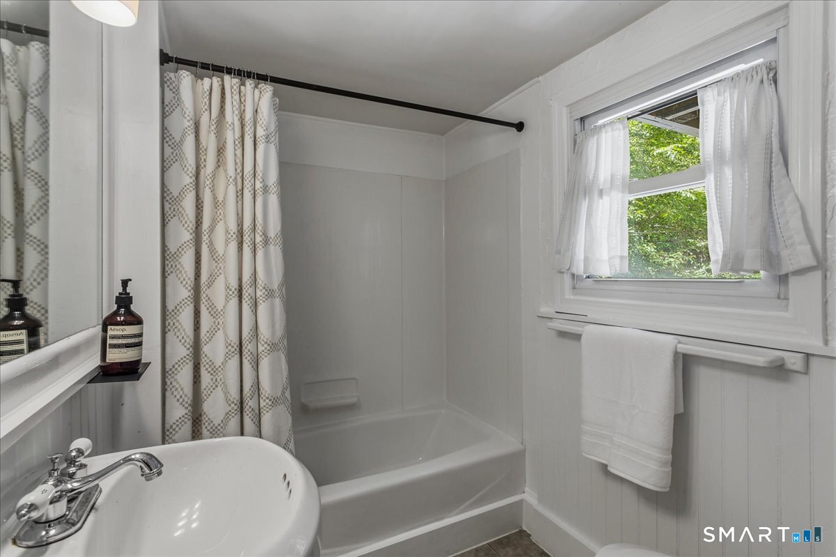 188 Bacon Road Roxbury, CT 06783 - Photo 14 of 33 a bathroom with a sink a bathtub and a shower