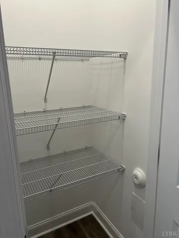 a front view of a house with yard and parking space