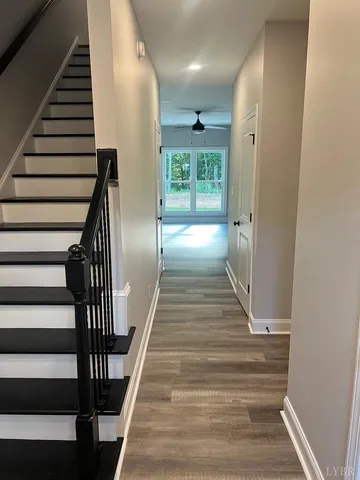 a kitchen with kitchen island white cabinets and stainless steel appliances