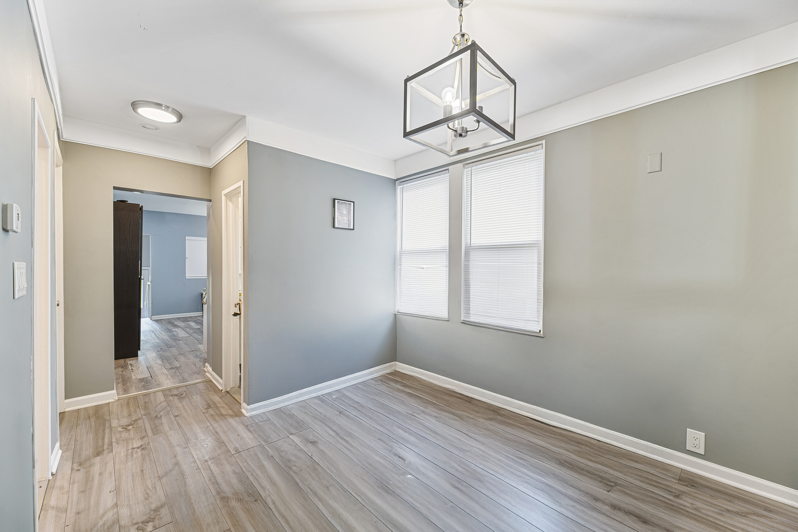 1S217 Valley Road Lombard, IL 60148 - Photo 5 of 23 a view of empty room with wooden floor and fan