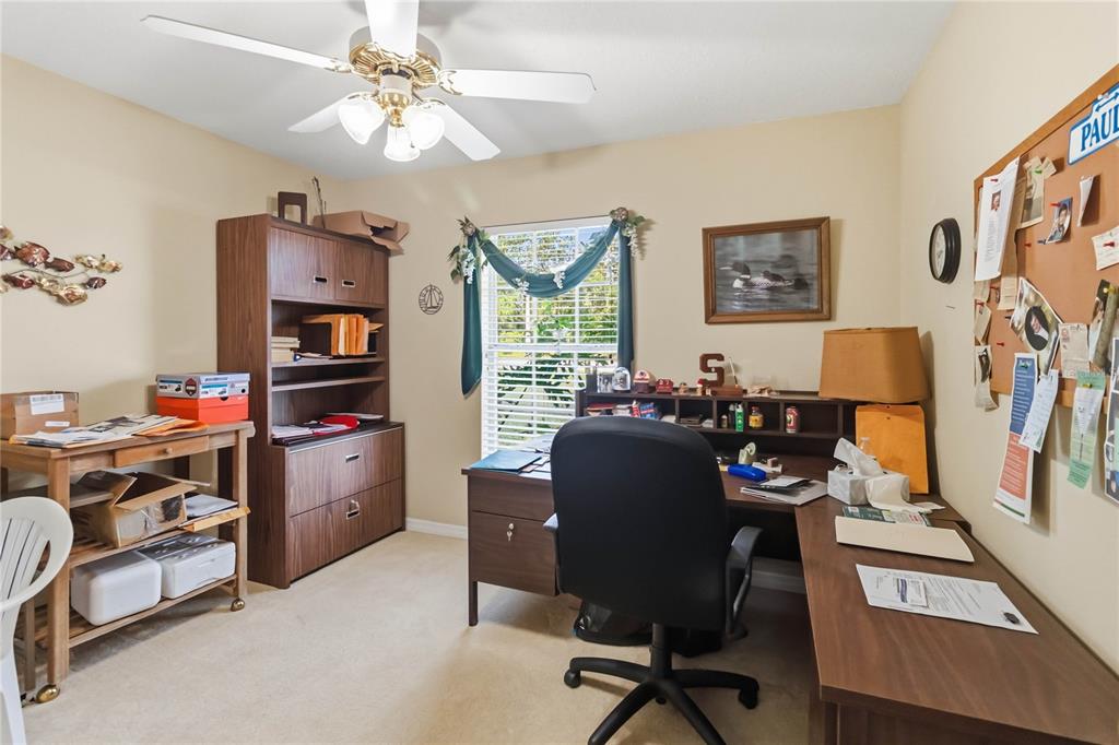 3225 Canoe Creek Road St. Cloud, FL 34772 - Photo 15 of 30 a view of a workspace with furniture and a window