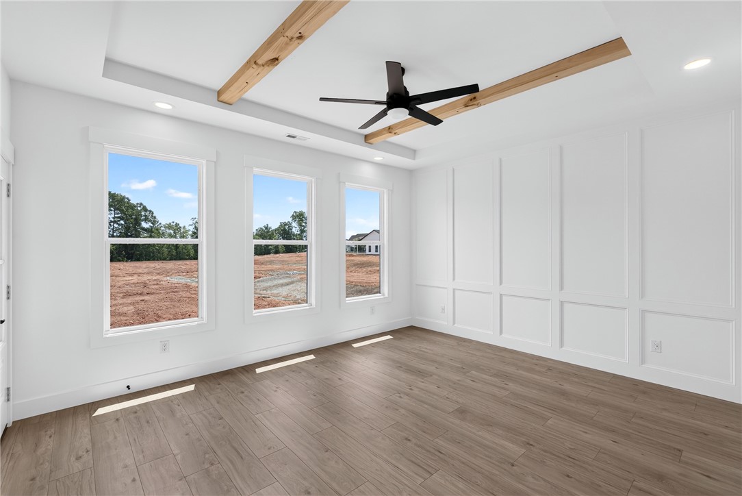 424 Blume Road Anderson, SC 29625 - Photo 16 of 30 Clean lines and abundant natural light define this inviting space, featuring a vaulted ceiling with exposed beams.