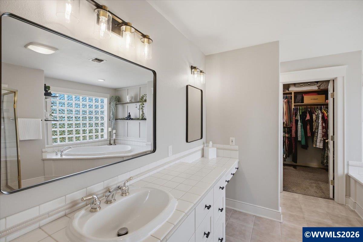 1492 Northwest Penny Lane Albany, OR 97321 - Photo 30 of 50 a bathroom with a sink and a mirror