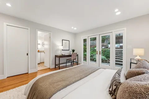 a bathroom with a sink vanity and shower