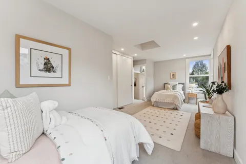 a patio with table and chairs and potted plants