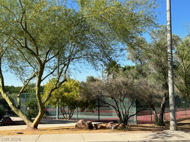 285 Spring Palms Street Henderson, NV 89012 - Photo 29 of 38 View of community with a tennis court and fence
