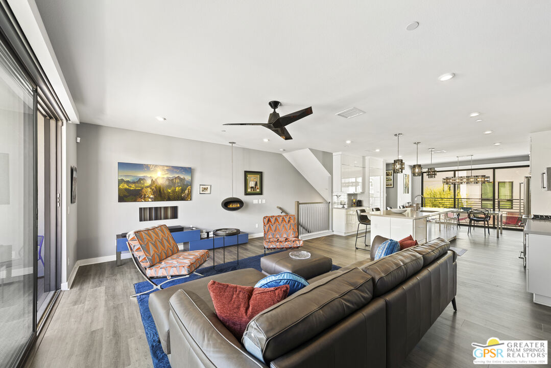 467 Huddle Spgs Way Palm Springs, CA 92264 - Photo 11 of 48 a living room with furniture and wooden floor