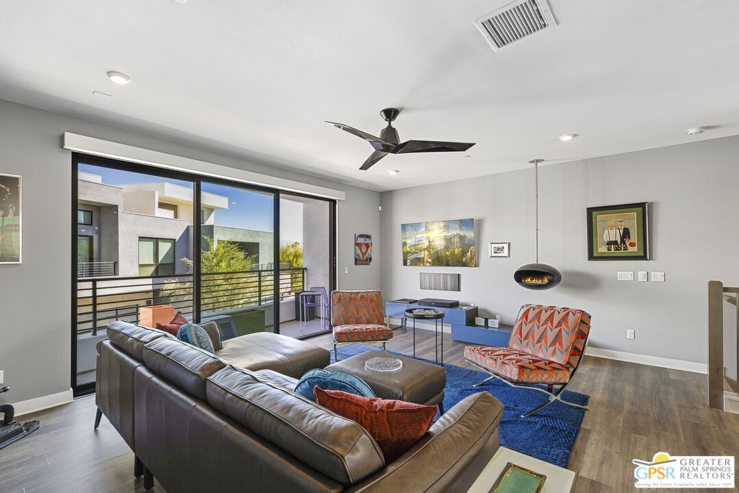 467 Huddle Spgs Way Palm Springs, CA 92264 - Photo 12 of 48 a living room with furniture and a large window