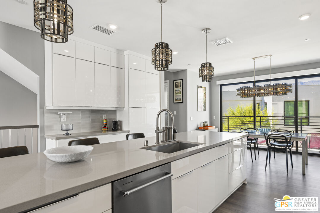 467 Huddle Spgs Way Palm Springs, CA 92264 - Photo 17 of 48 a kitchen with counter top space a sink appliances and cabinets