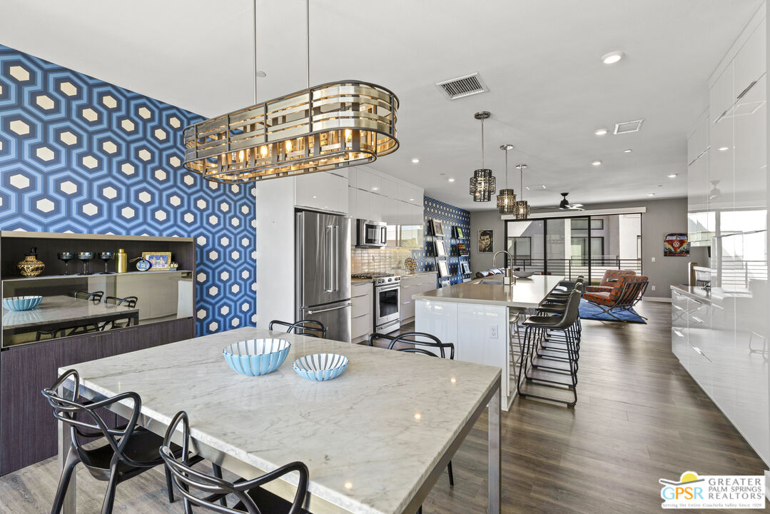 467 Huddle Spgs Way Palm Springs, CA 92264 - Photo 20 of 48 a view of a dining room with furniture and a chandelier