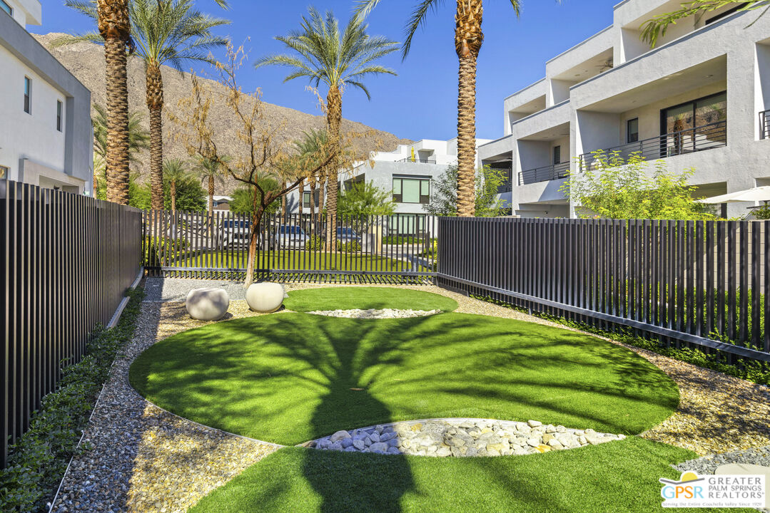 467 Huddle Spgs Way Palm Springs, CA 92264 - Photo 35 of 48 a view of a backyard with a garden