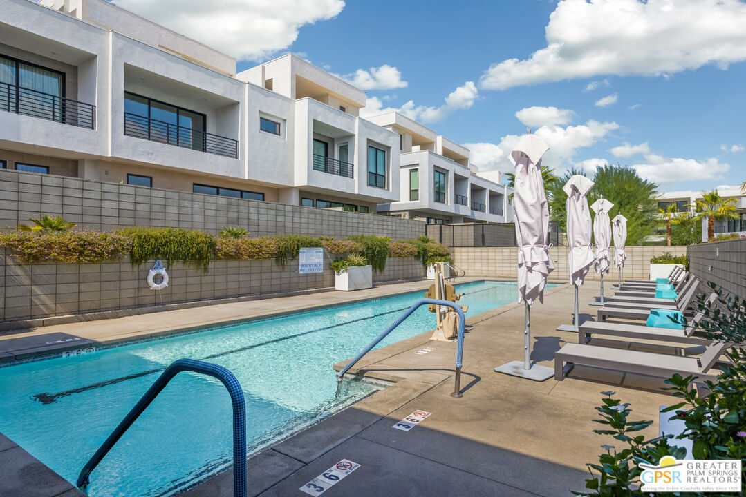 467 Huddle Spgs Way Palm Springs, CA 92264 - Photo 42 of 48 a view of a patio with a table and chairs