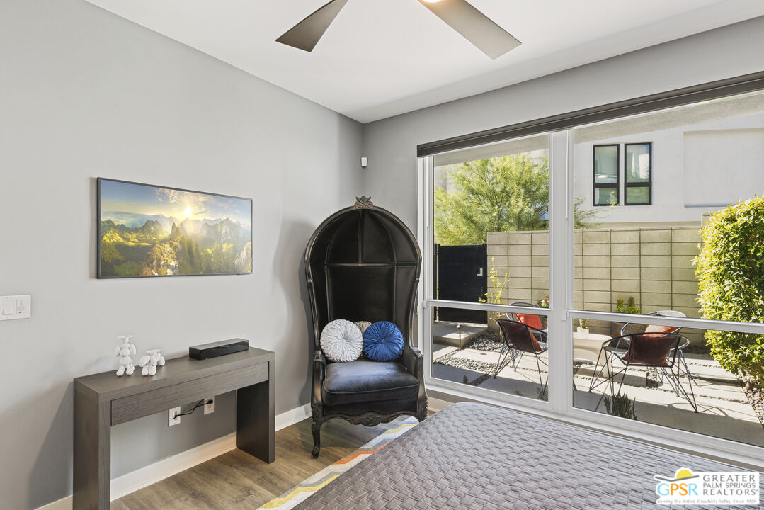 467 Huddle Spgs Way Palm Springs, CA 92264 - Photo 8 of 48 a living room with furniture a rug and a large window
