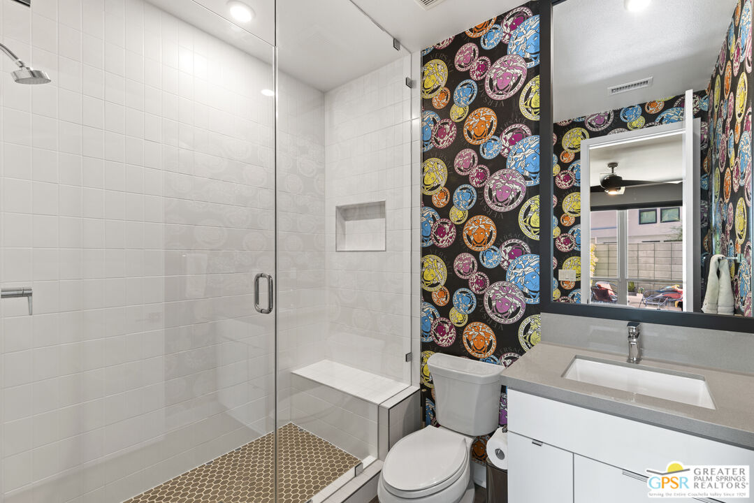 467 Huddle Spgs Way Palm Springs, CA 92264 - Photo 10 of 48 a bathroom with a sink toilet and shower