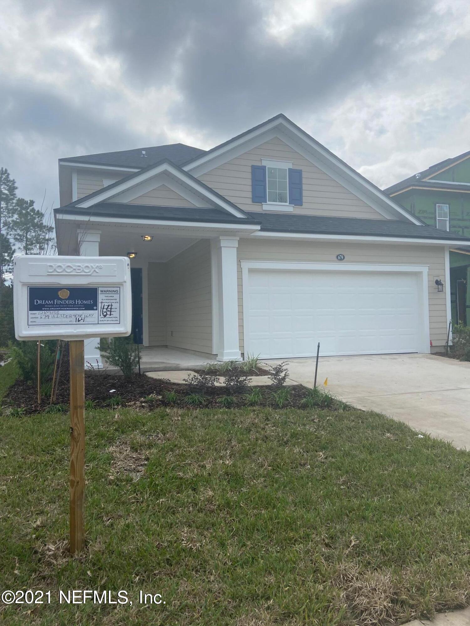 679 Windermere Way St. Augustine, FL 32095 - Photo 3 of 15 a front view of a house with a yard