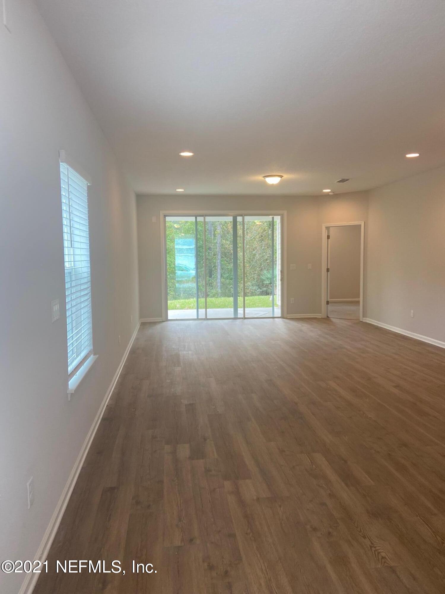 679 Windermere Way St. Augustine, FL 32095 - Photo 6 of 15 a view of an empty room with a window