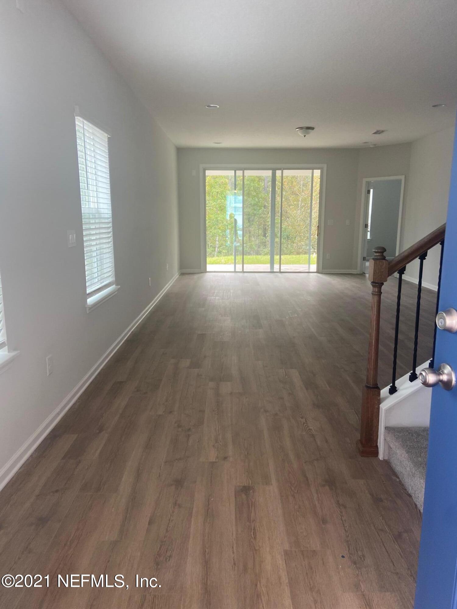 679 Windermere Way St. Augustine, FL 32095 - Photo 7 of 15 a view of livingroom with hardwood floor and window