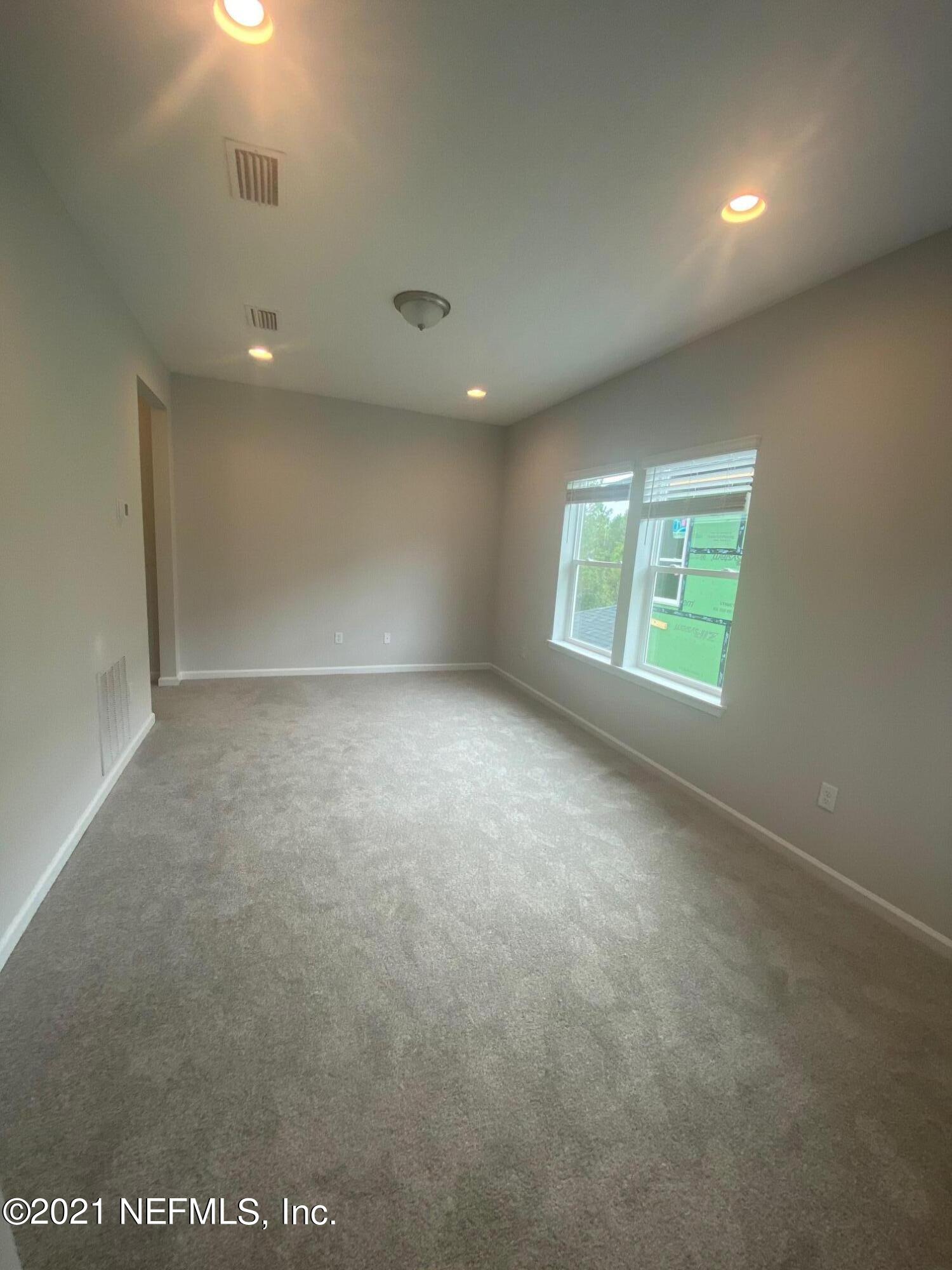 679 Windermere Way St. Augustine, FL 32095 - Photo 10 of 15 an empty room with windows