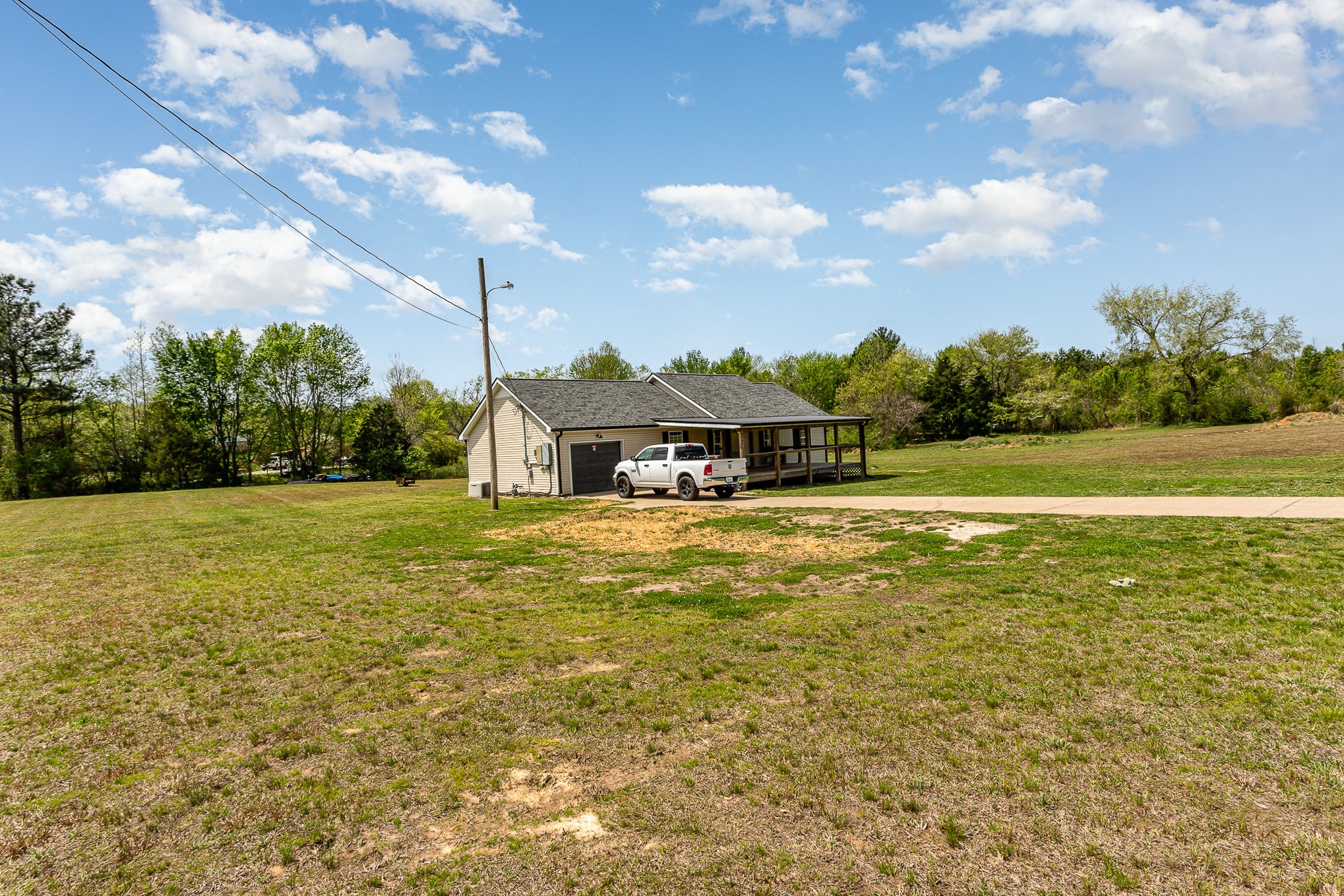 7953 Spot Light Road Lyles, TN 37098 - Photo 2 of 19 a view of a house with a big yard