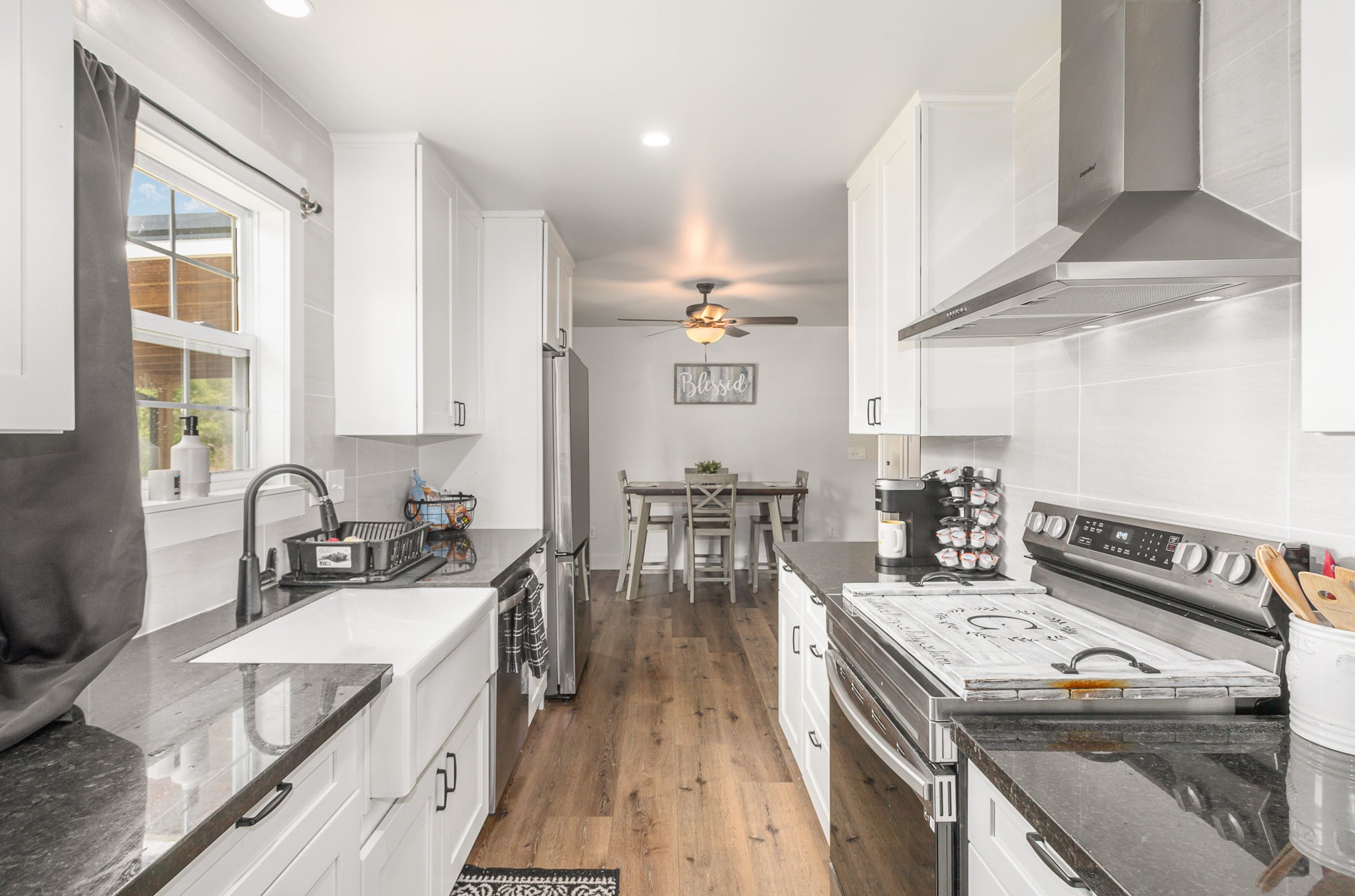 7953 Spot Light Road Lyles, TN 37098 - Photo 5 of 19 a kitchen with a stove a sink and a refrigerator