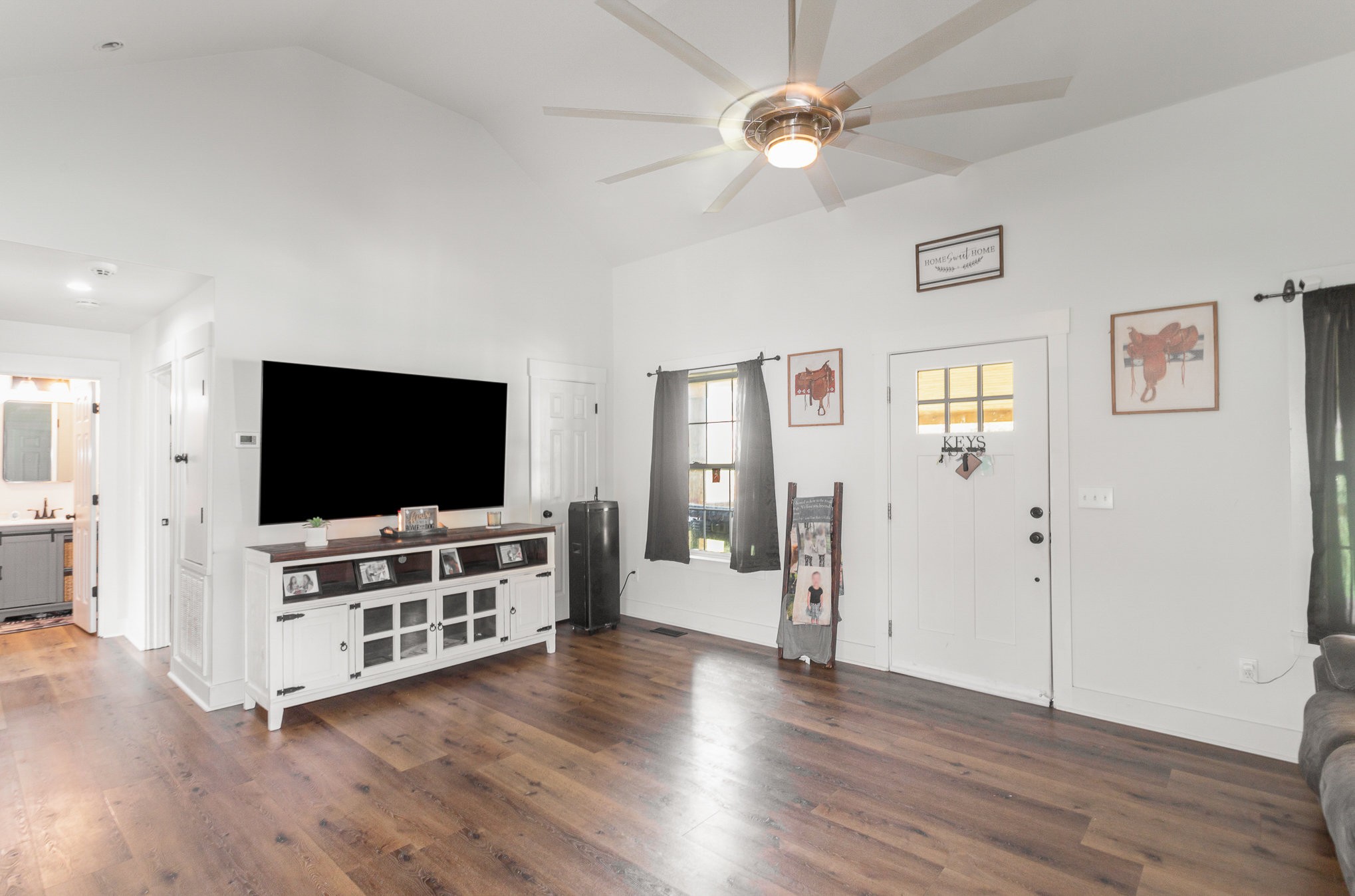 7953 Spot Light Road Lyles, TN 37098 - Photo 7 of 19 a living room with furniture and a flat screen tv